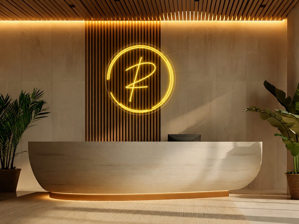 Custom warm-gold monogram spa reception neon sign